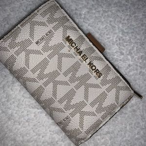 White and brown MK wallet
